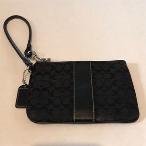 Coach black logo wristlet.  Material and leather combination.  Gently used.